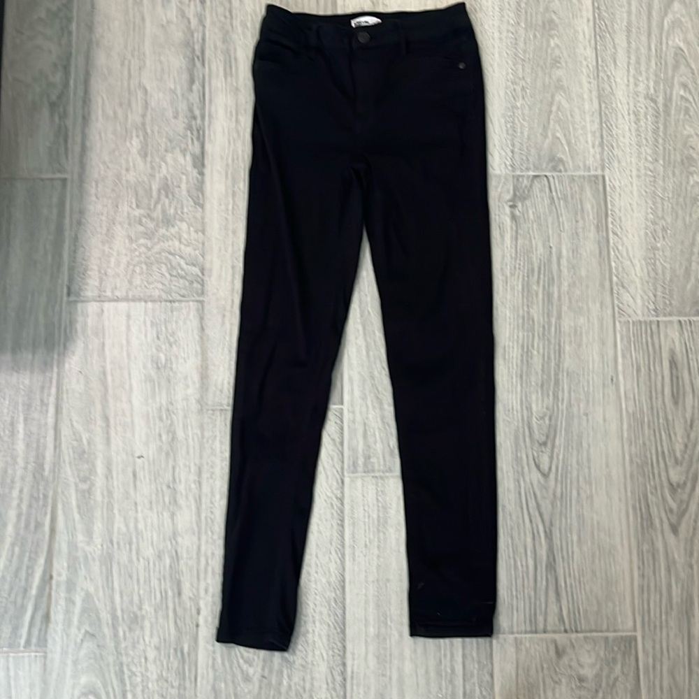 Girls black stretchy jeans. Size 12.